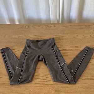 Lululemon Athletica Gray Leggings with silver and black piping/accents. Size 2